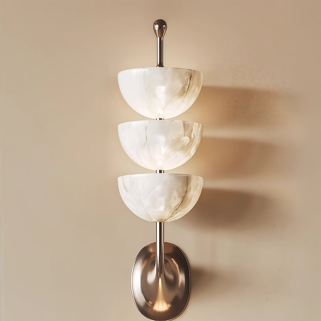 Minimalist modern LED wall lights featuring glass shade chandelier styling shown in warm neutral interior with uplighting effect.