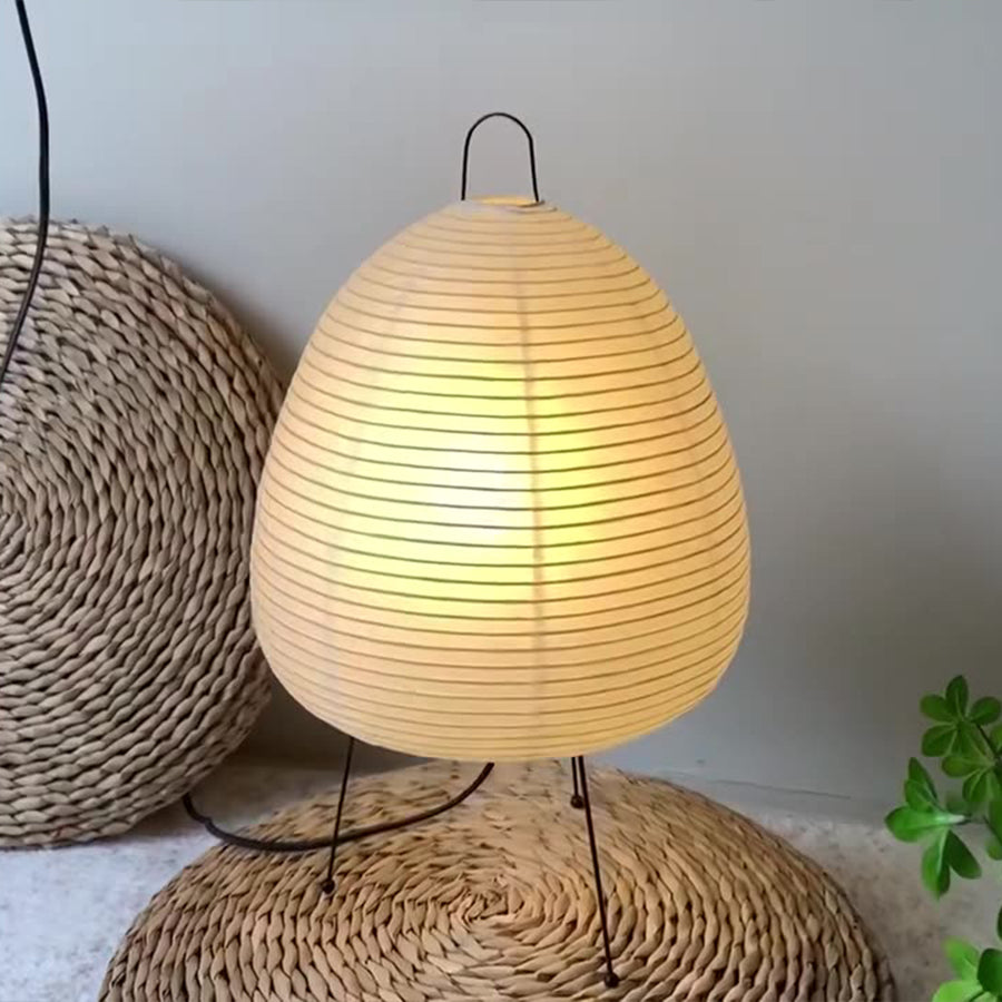 Stacked rice paper table lamp in a minimalist room, elegant and creative lighting solution