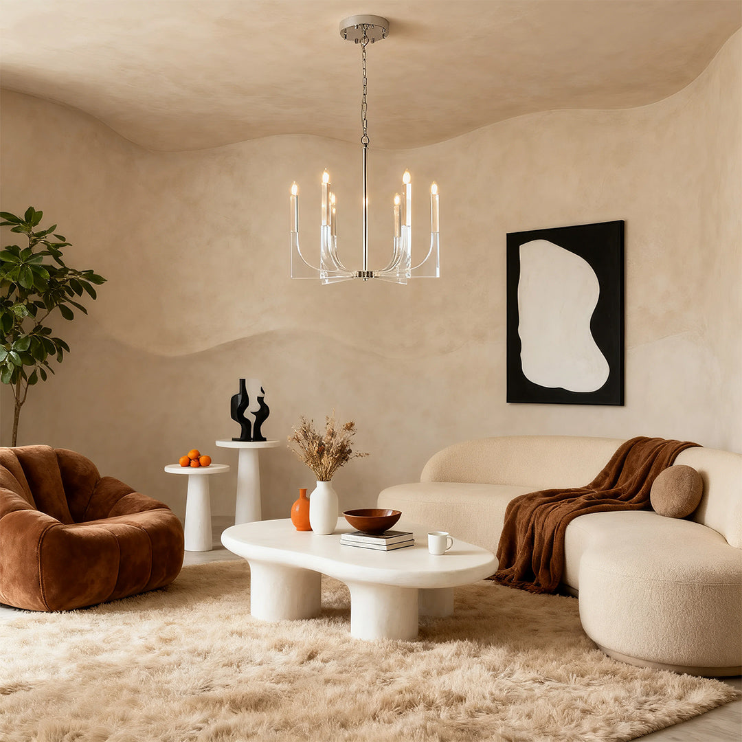 Minimalist retro chandeliers providing subtle light in a warm-toned living room with a textured rug and curved seating arrangement.