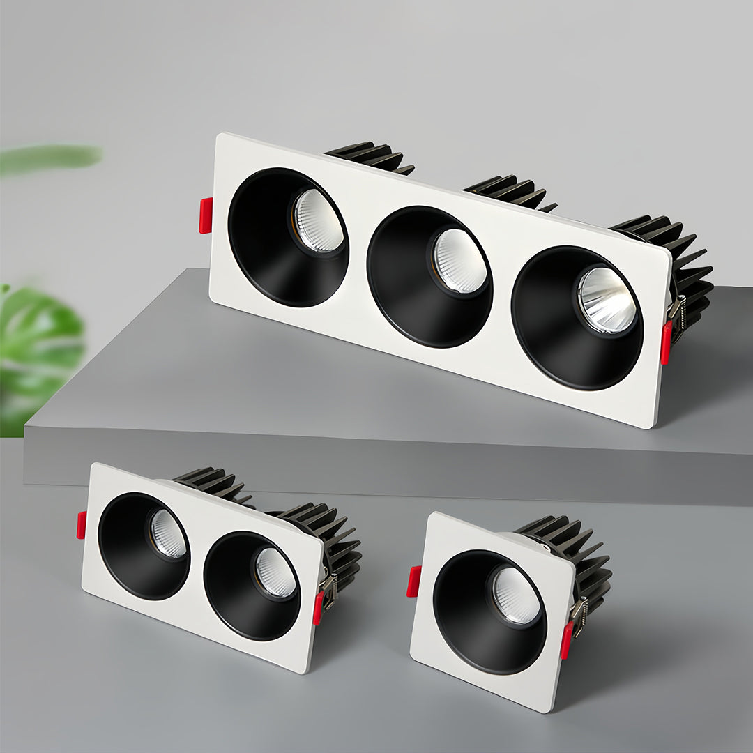 Minimalist triple square recessed downlight with black interior and white trim