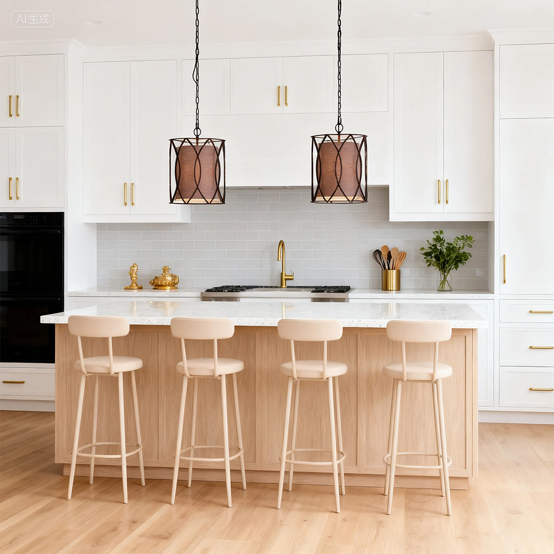 Minimalist white kitchen featuring two small black pendant light fixtures with a unique brown inner shade over a light wood island.