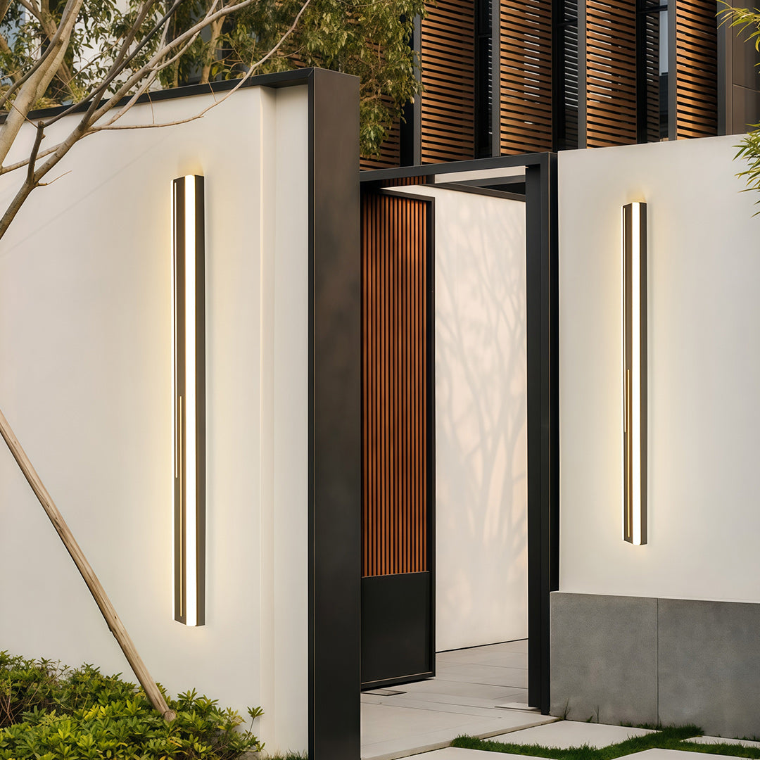 Modern minimalist outdoor wall mount lighting featuring narrow vertical profile with metal accents