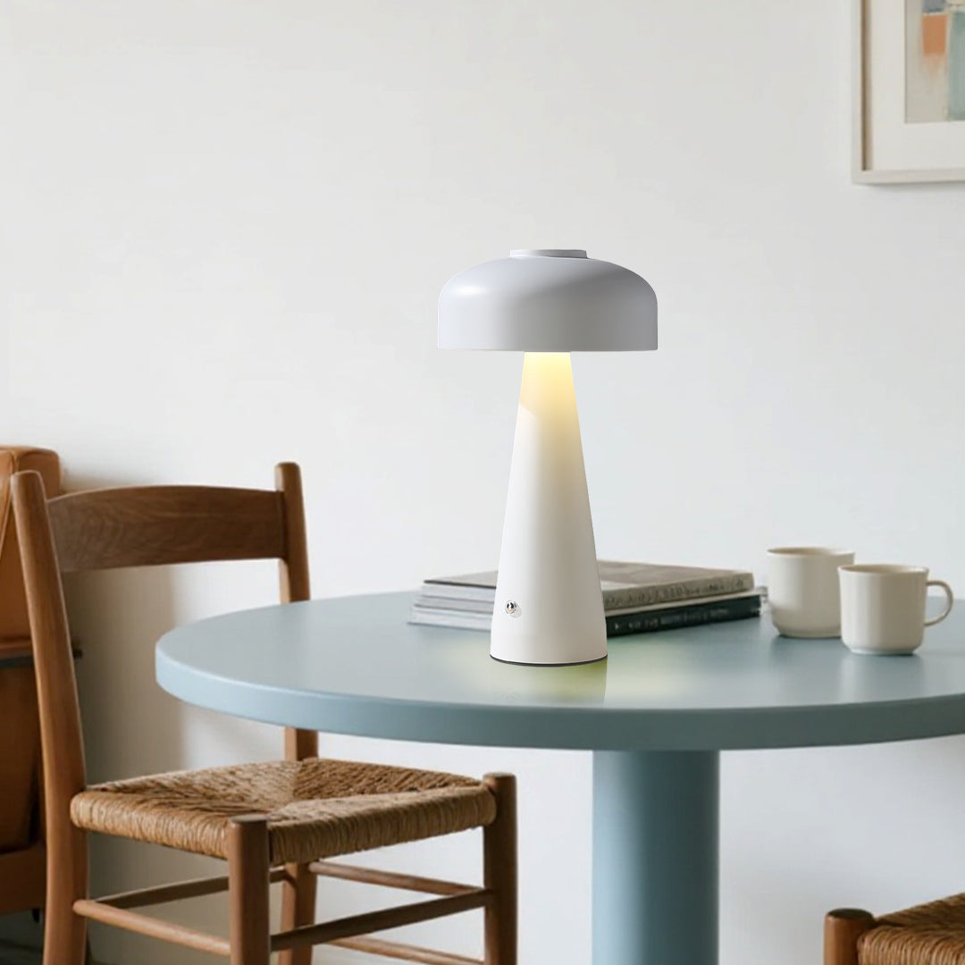 Minimalist dining area featuring small black pendant light as elegant white mushroom centerpiece