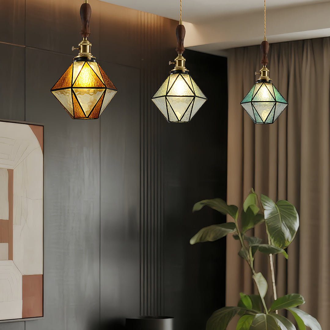 Mixed diamond-shaped pendant lights in elegant dining room with warm tones and contemporary furniture arrangement