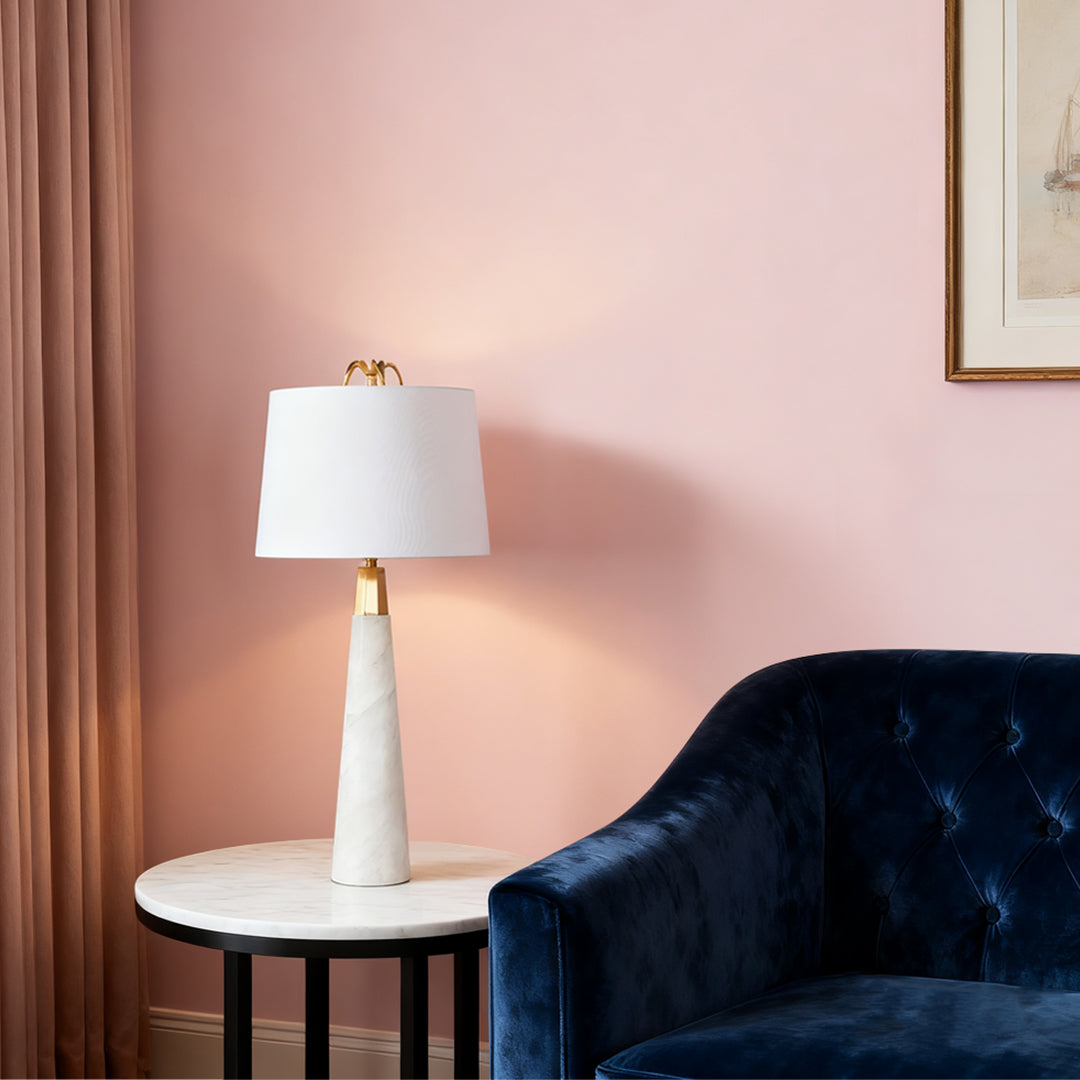 Elegant white marble table lamp with beige lampshade in a contemporary living room