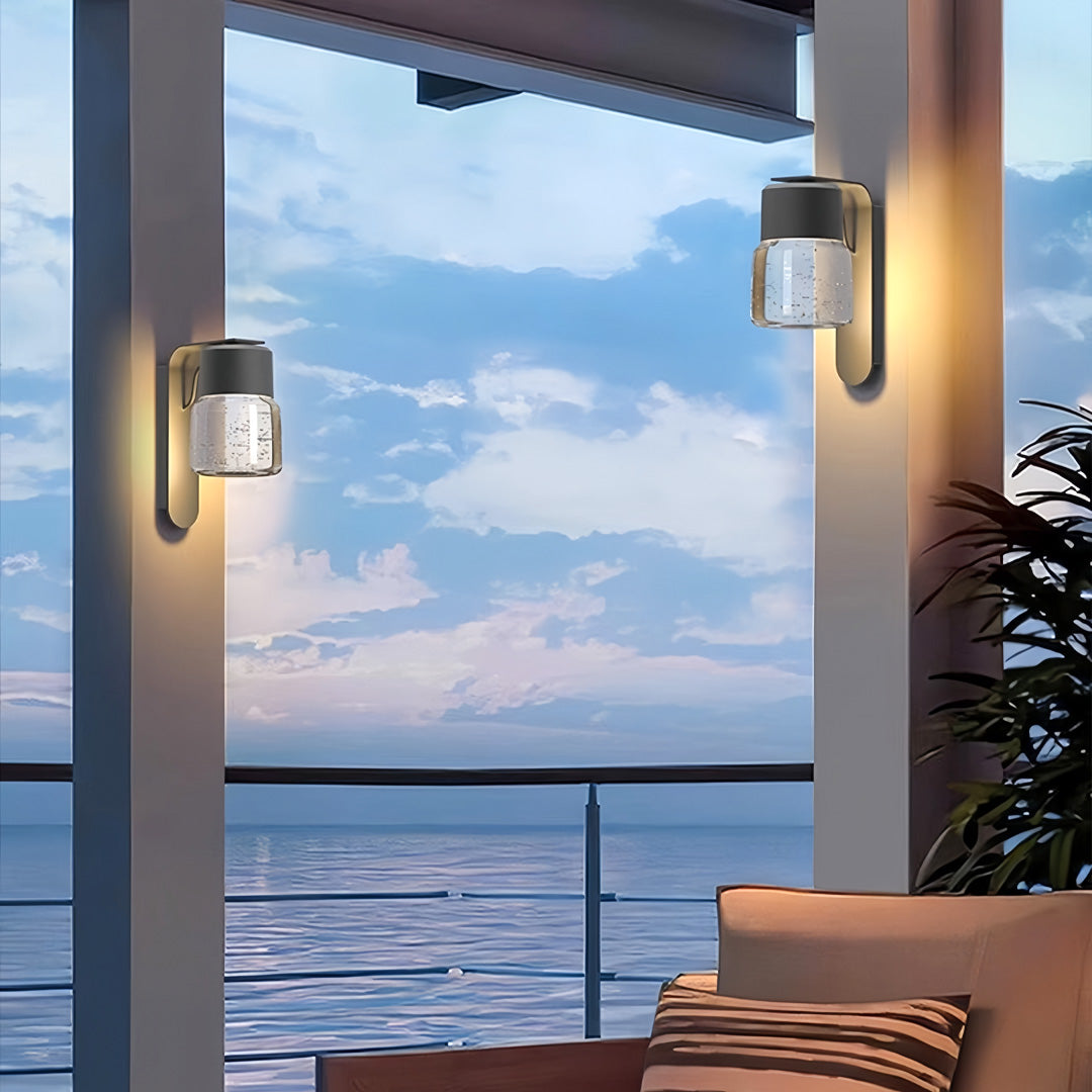 Exterior wall mount lights used on modern architecture producing warm outdoor lighting.