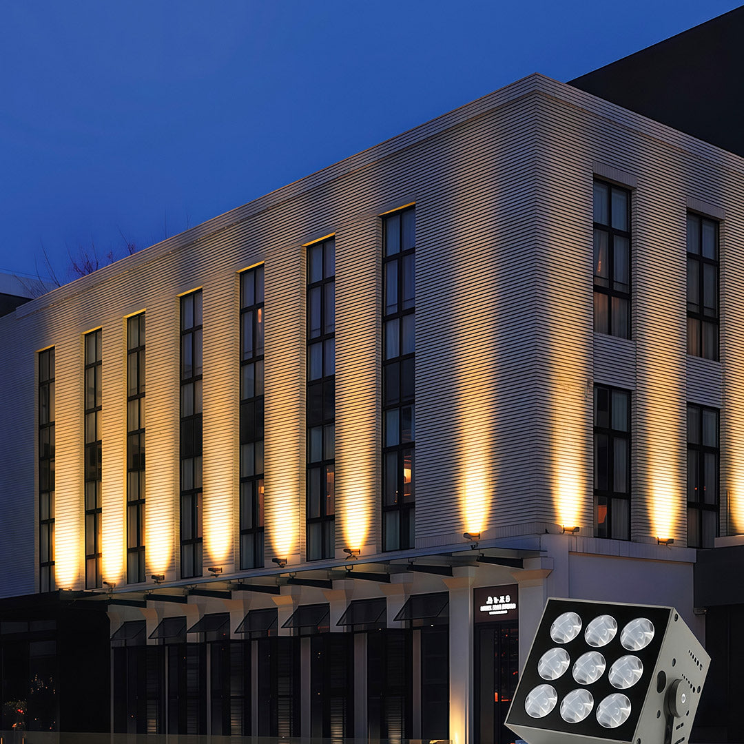 Modern building architecture illuminated by square LED wall wash lights.