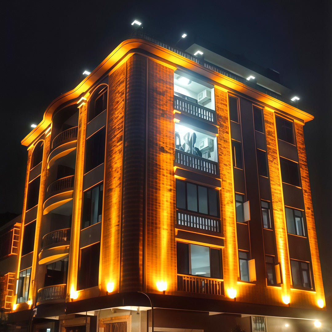 Modern building architecture illuminated by square LED wall wash lights.