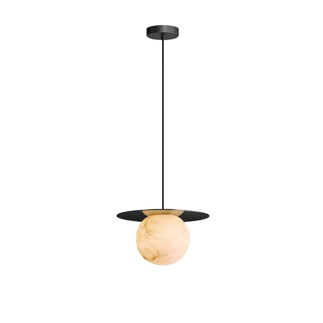 Modern ball pendant light with a white marble sphere and brass accents, suspended from the ceiling.