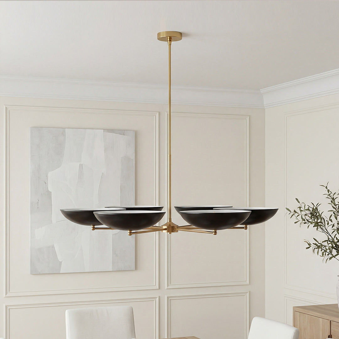 Elegant black and gold chandeliers with modern upward bowl shades and a sleek brass fixture.