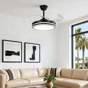 Modern black ceiling fan with lights installed over a beige living room sofa 