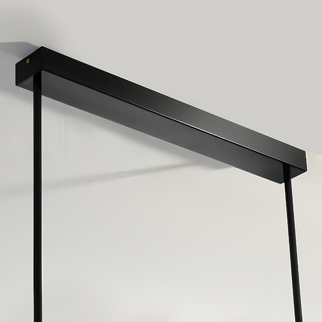 Modern LED linear pendant light with black frame mounted on contemporary ceiling installation