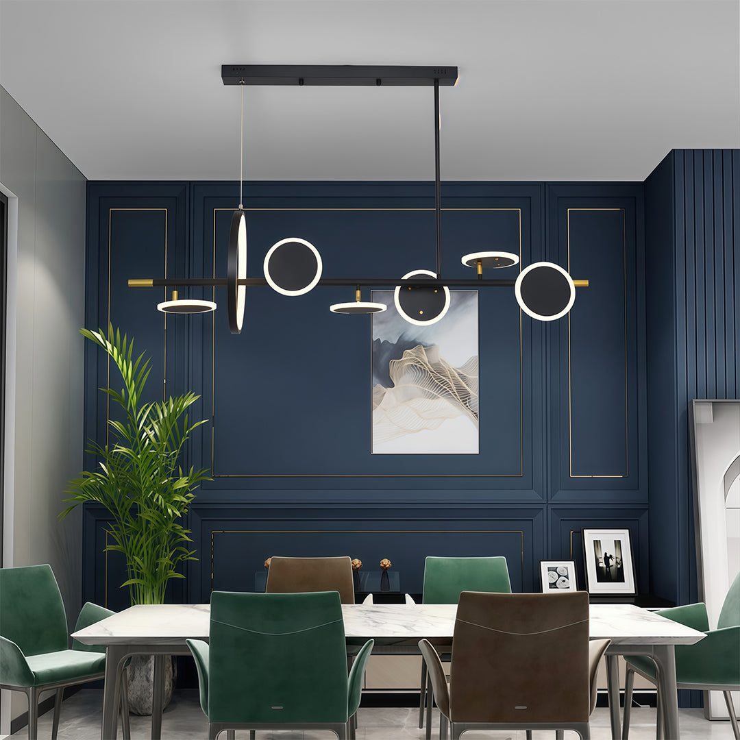 Modern black linear 6 light chandelier featuring multiple geometric rings and a dramatic dark blue dining room setting.