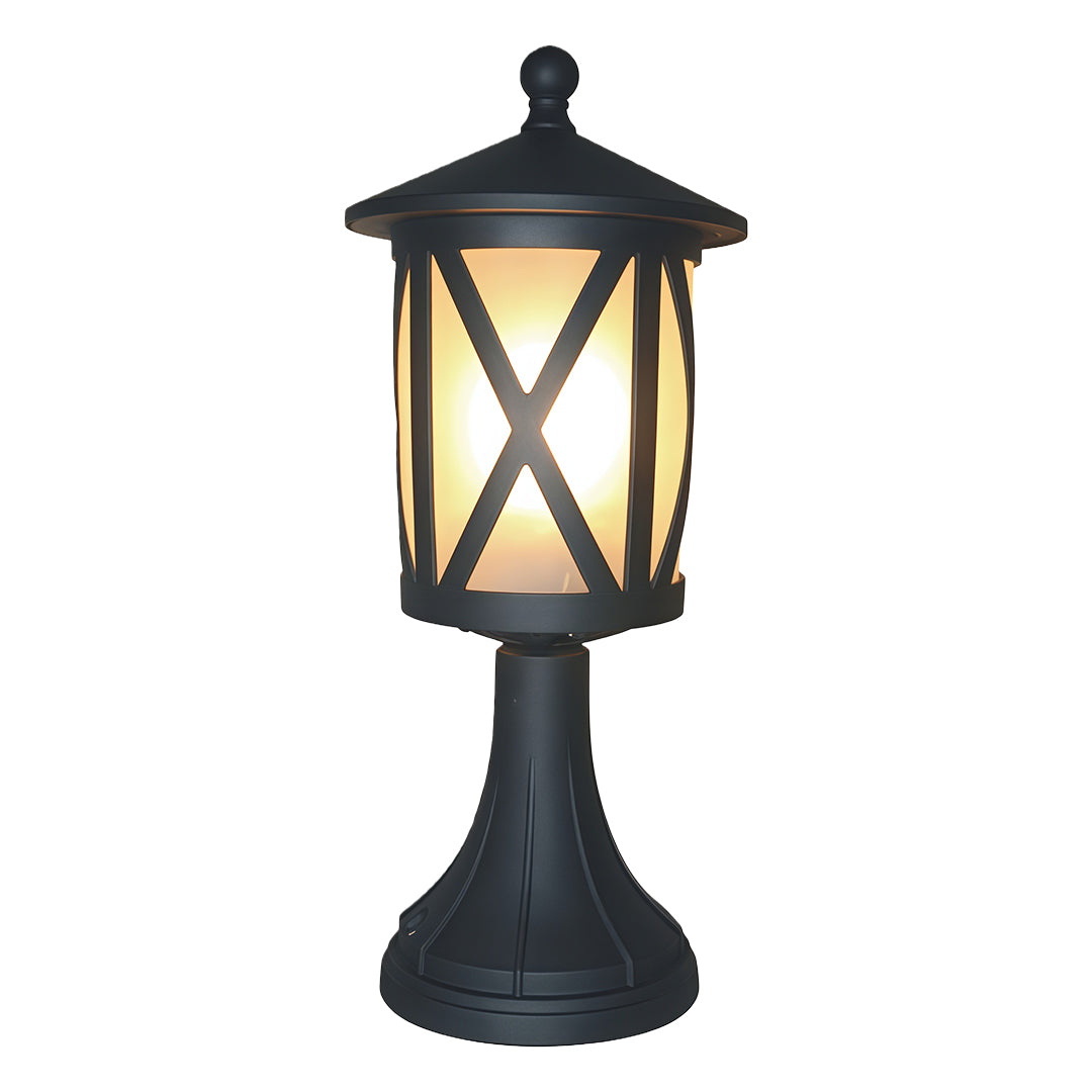 Modern black outdoor pillar light featuring X-pattern glass panels and decorative top finial on white background