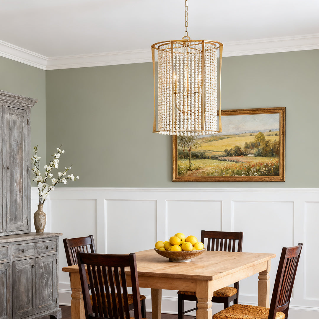 white wood beaded chandelier with gold frame in a refined dining area
