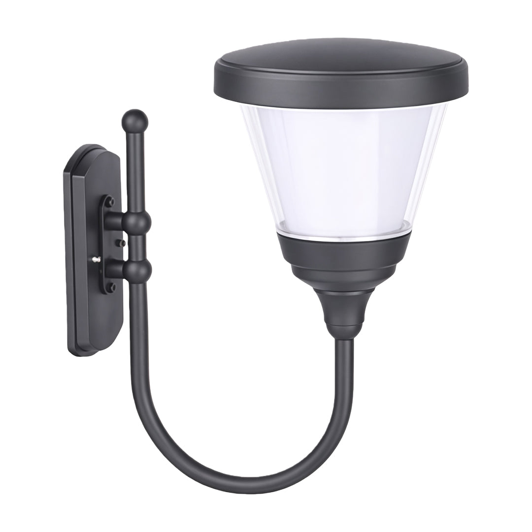 Modern black outdoor wall mount light mounted on a stone pillar, casting light across a garden area.