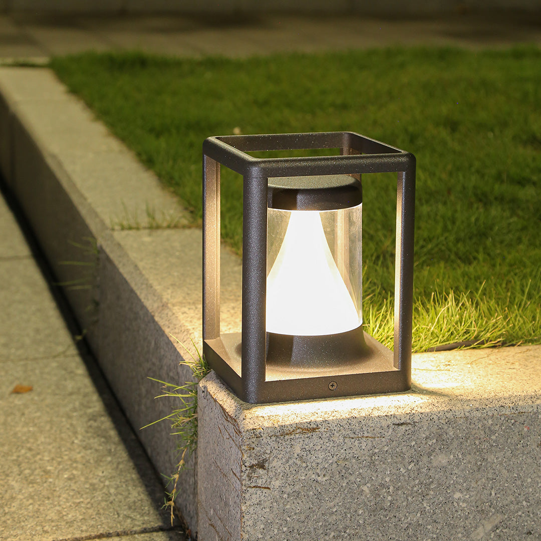 Concrete pathway with integrated bollard lighting creating clean modern outdoor illumination design