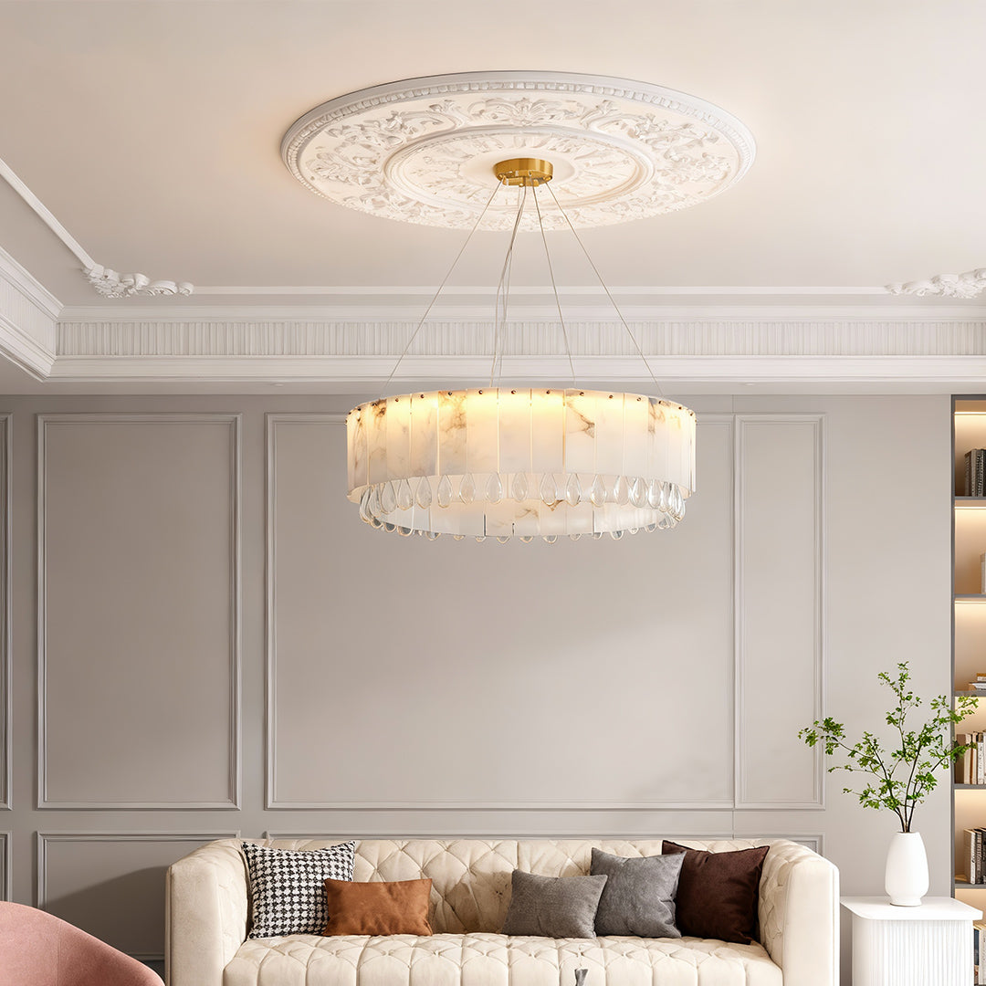 Brass chandelier hanging over dining table in a contemporary dining room.