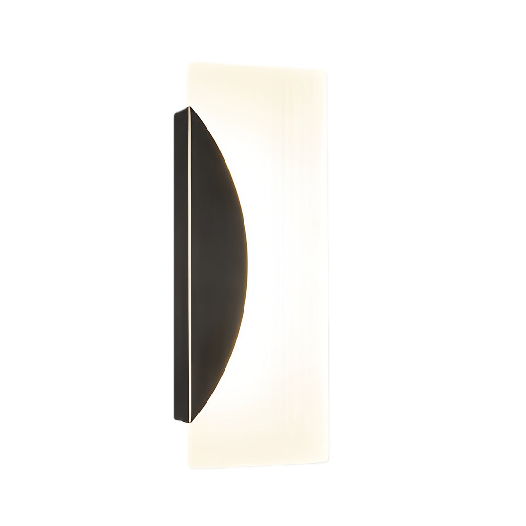 Modern brass wall lights featuring curved black metal backplate with vertical frosted glass shade element