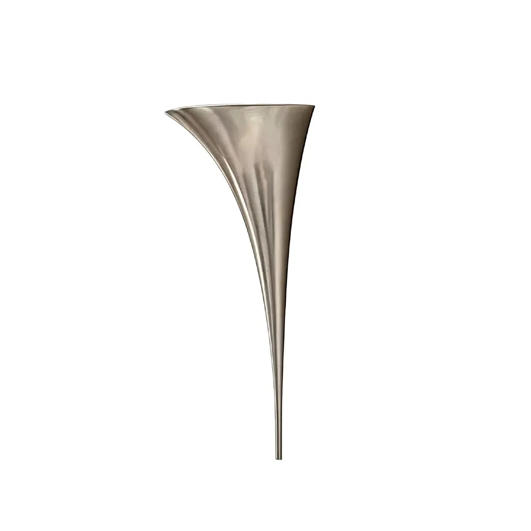 Modern brass wall sconce in a chrome finish isolated on a white background.