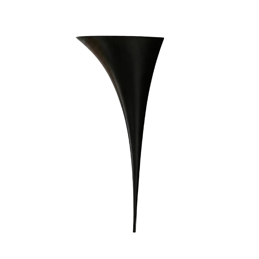 Modern brass wall sconce in a large black finish version isolated on a white background.