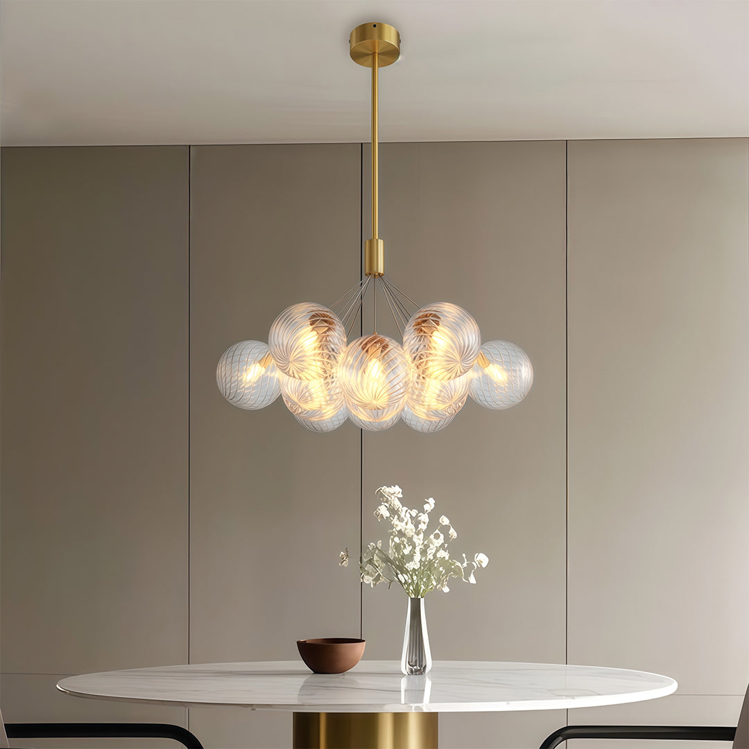 modern bubble chandelier used as bedroom lighting above a bedside table