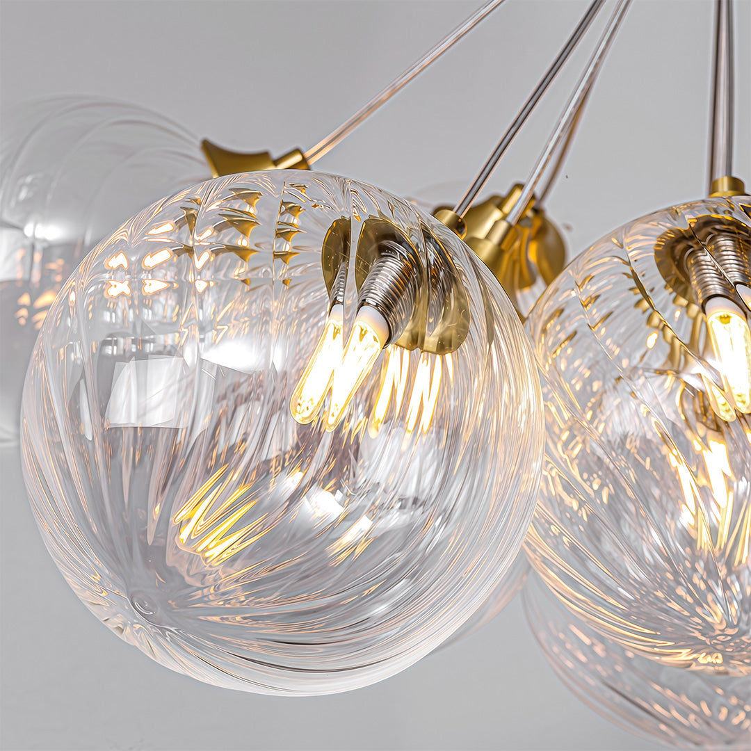 gold modern bubble chandelier hanging in a stylish bedroom interior