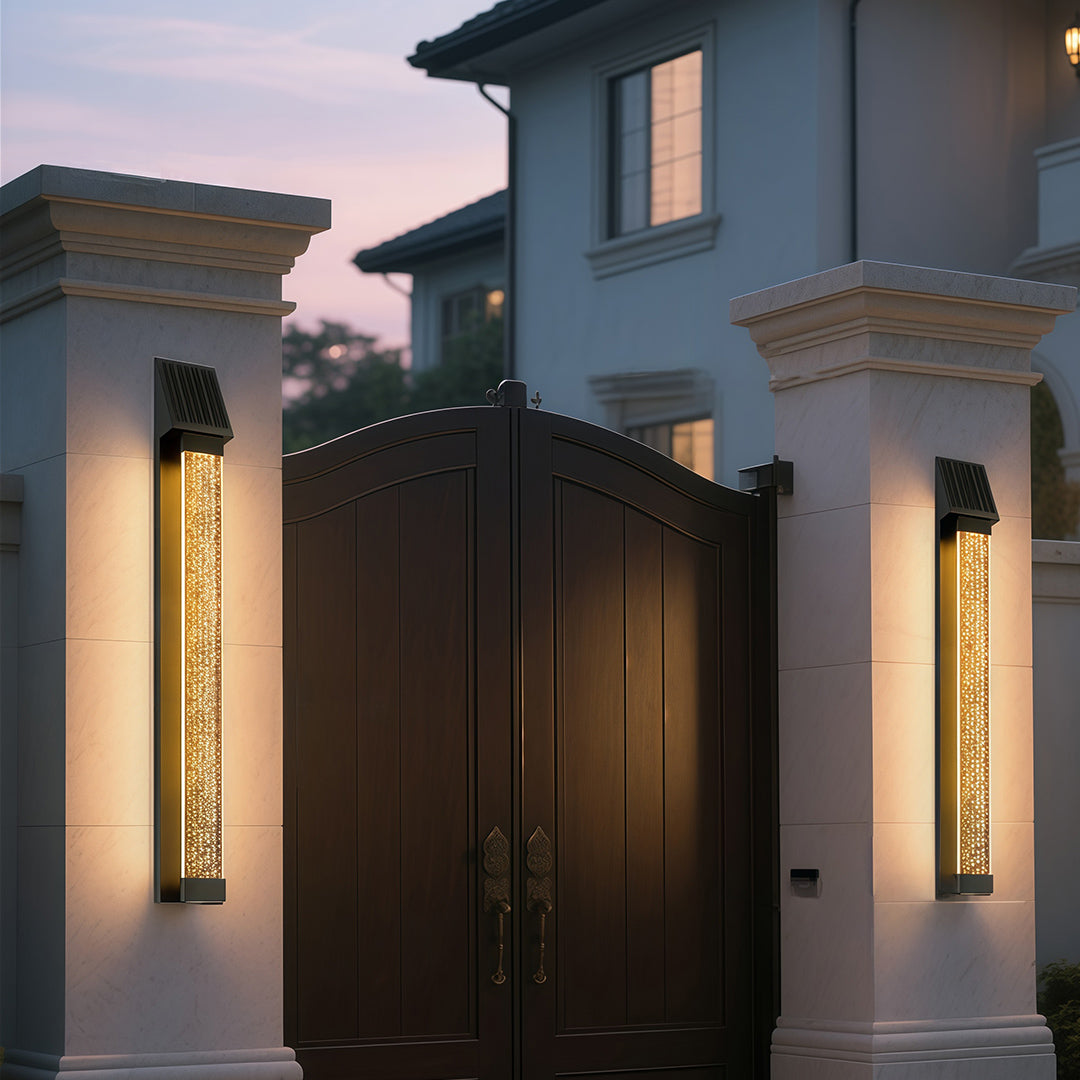Black outdoor lighting sconce with a textured glass front, enhancing the exterior of a modern building.