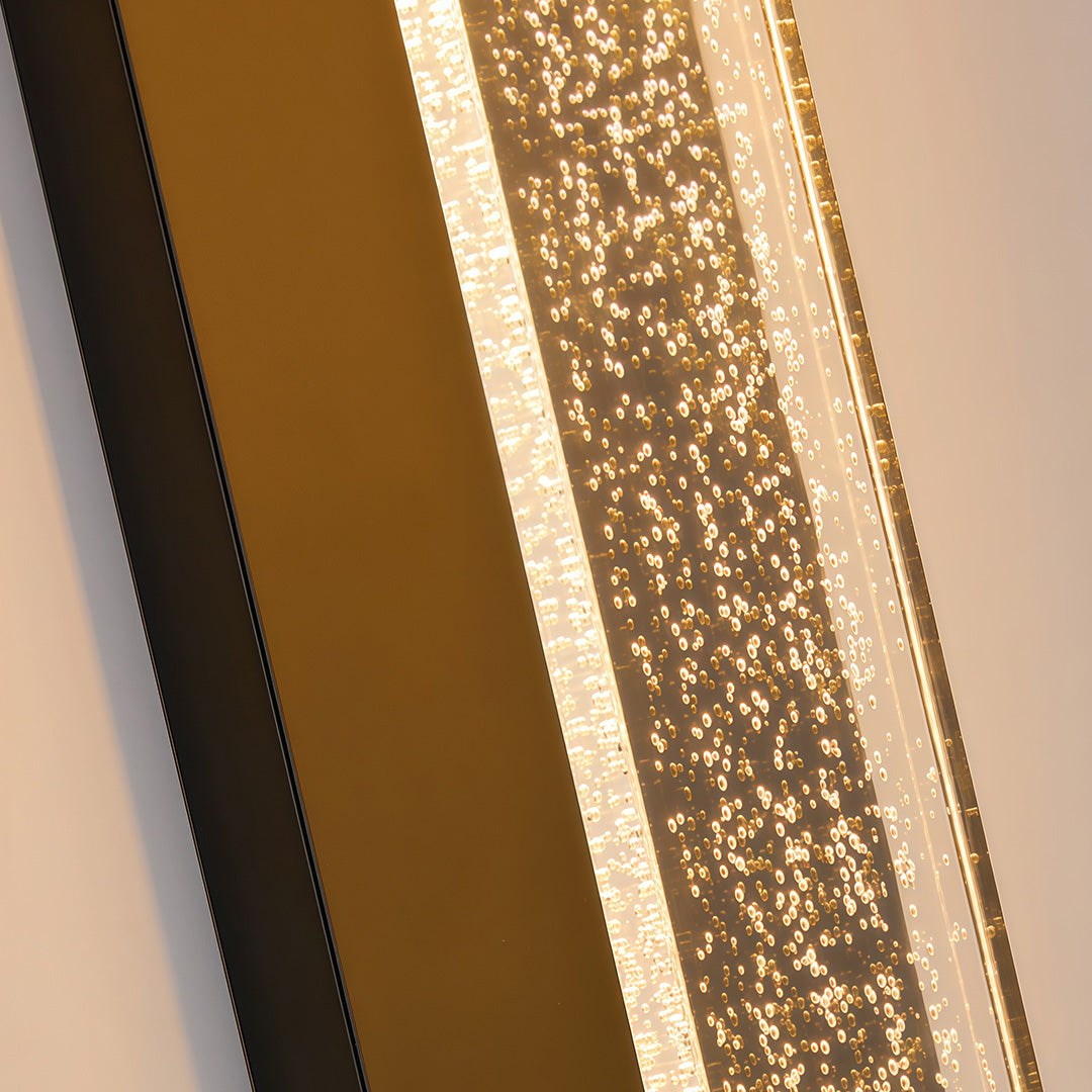 Black outdoor lighting sconce with a textured glass front, enhancing the exterior of a modern building.