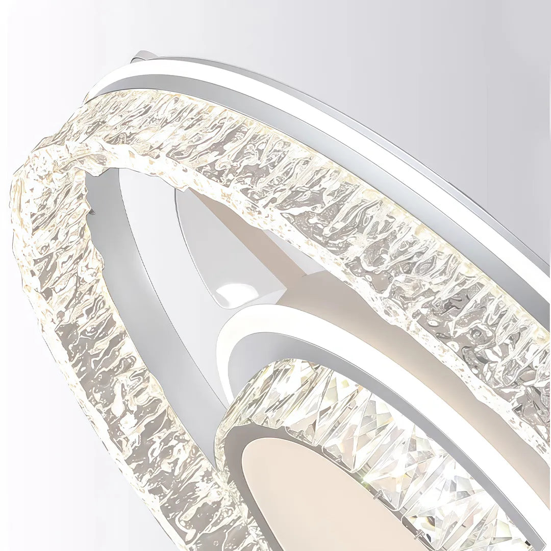 Modern ceiling fan with lights close-up showing the sparkling crystal outer ring and sleek white frame.