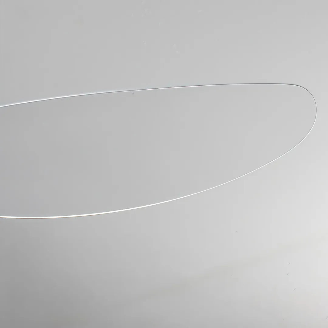 Close-up of a slim white blade from modern ceiling fans with LED lights.