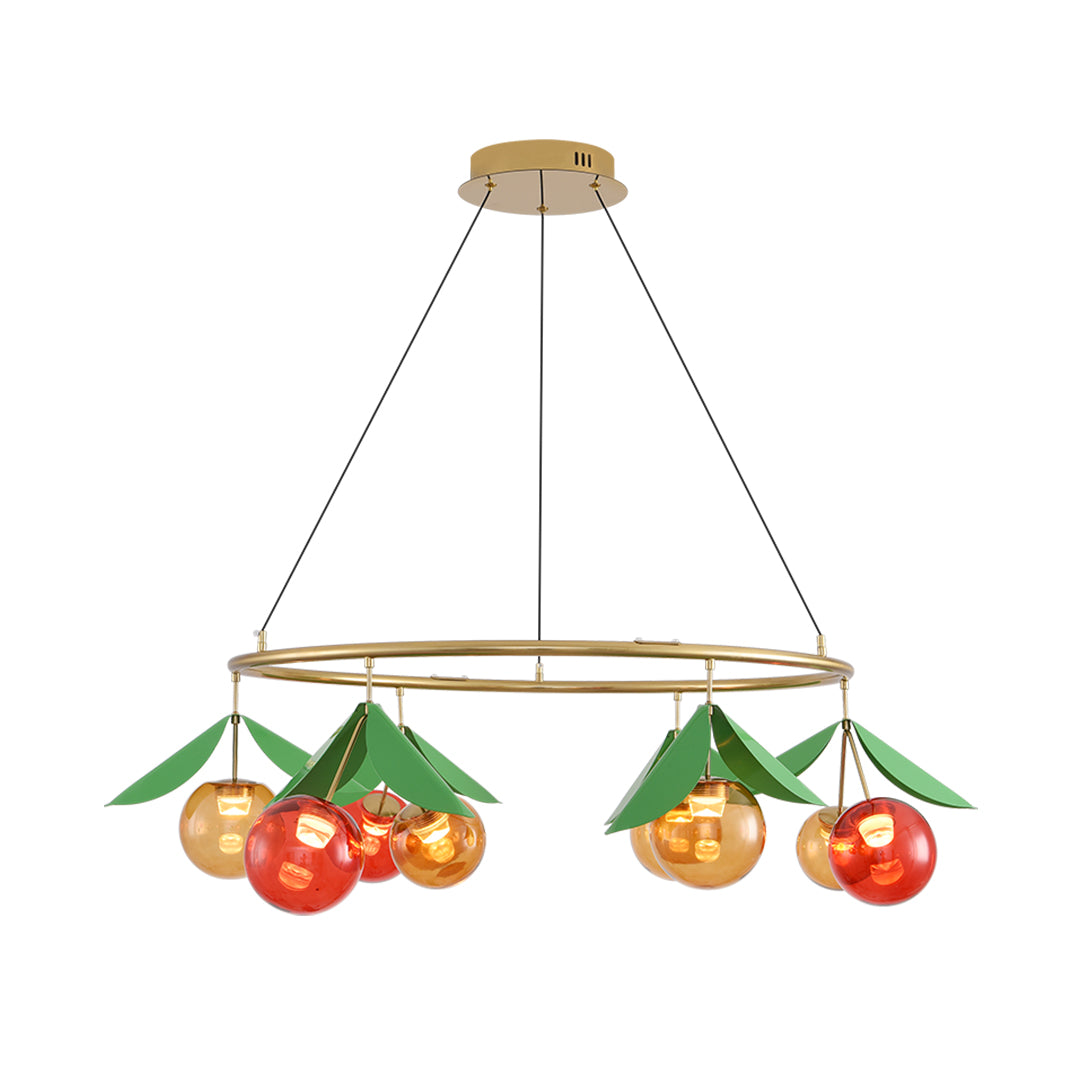 Modern cherry chandelier featuring red and amber glass orbs suspended from circular brass frame with green leaf details
