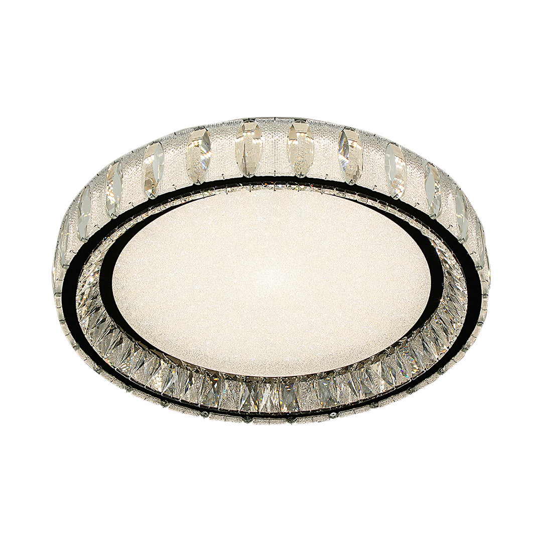 Modern chrome flush mount light with a sleek oval design and crystal accents, perfect for contemporary interiors.