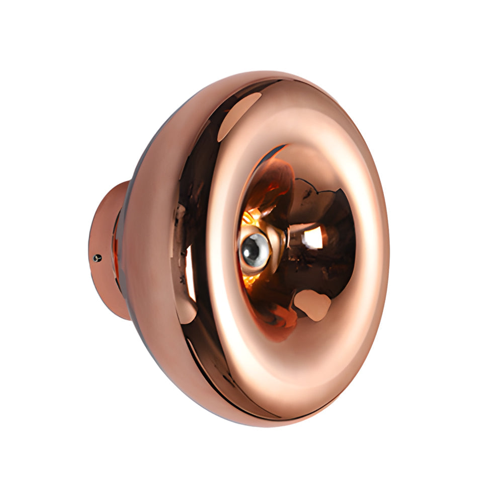 Close-up of modern chrome wall sconce showcasing its golden interior and chrome finish.