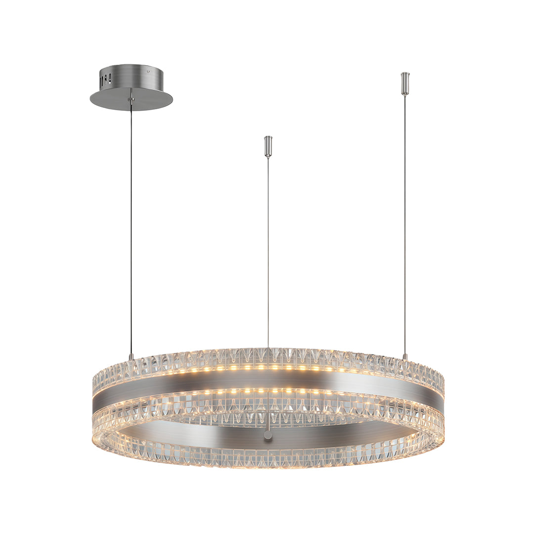 Modern circular chandelier with a gold finish, hanging above a dining table in a bright room.