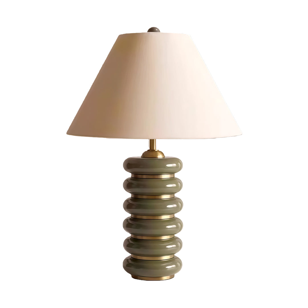 Modern cloth table lamp with glass shade chandelier aesthetic in sculptural tiered base with warm wood finish and conical shade.