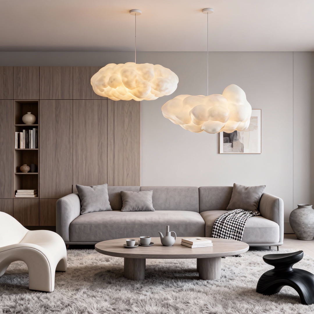 Contemporary cloud-shaped pendant light arrangement in a modern neutral-toned living room.
