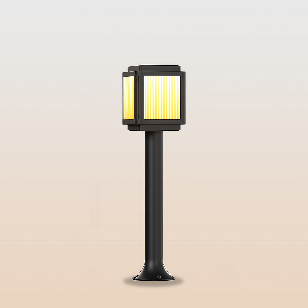 Modern contemporary solar path light with a sleek black square design and warm light, perfect for garden pathways.