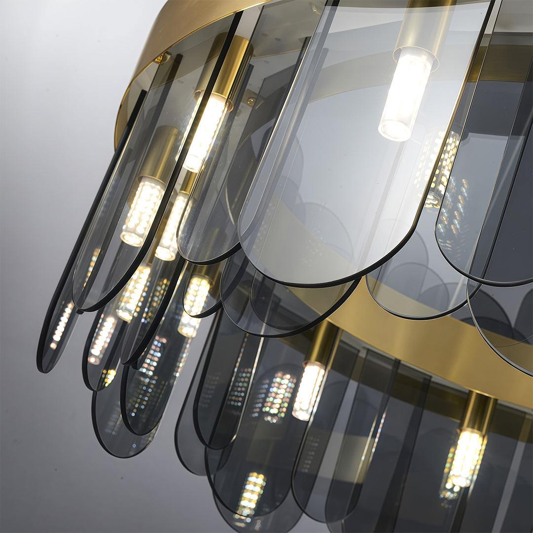 Modern luxury chandeliers close-up showcasing brass frame and smoked glass detail