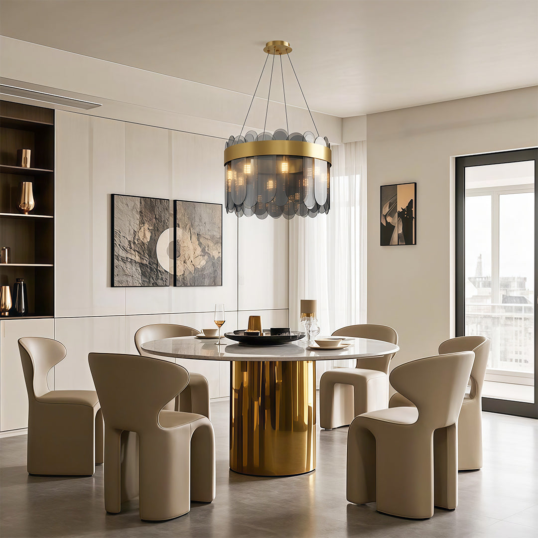 Modern luxury chandeliers illuminating elegant dining room with round table and beige chairs