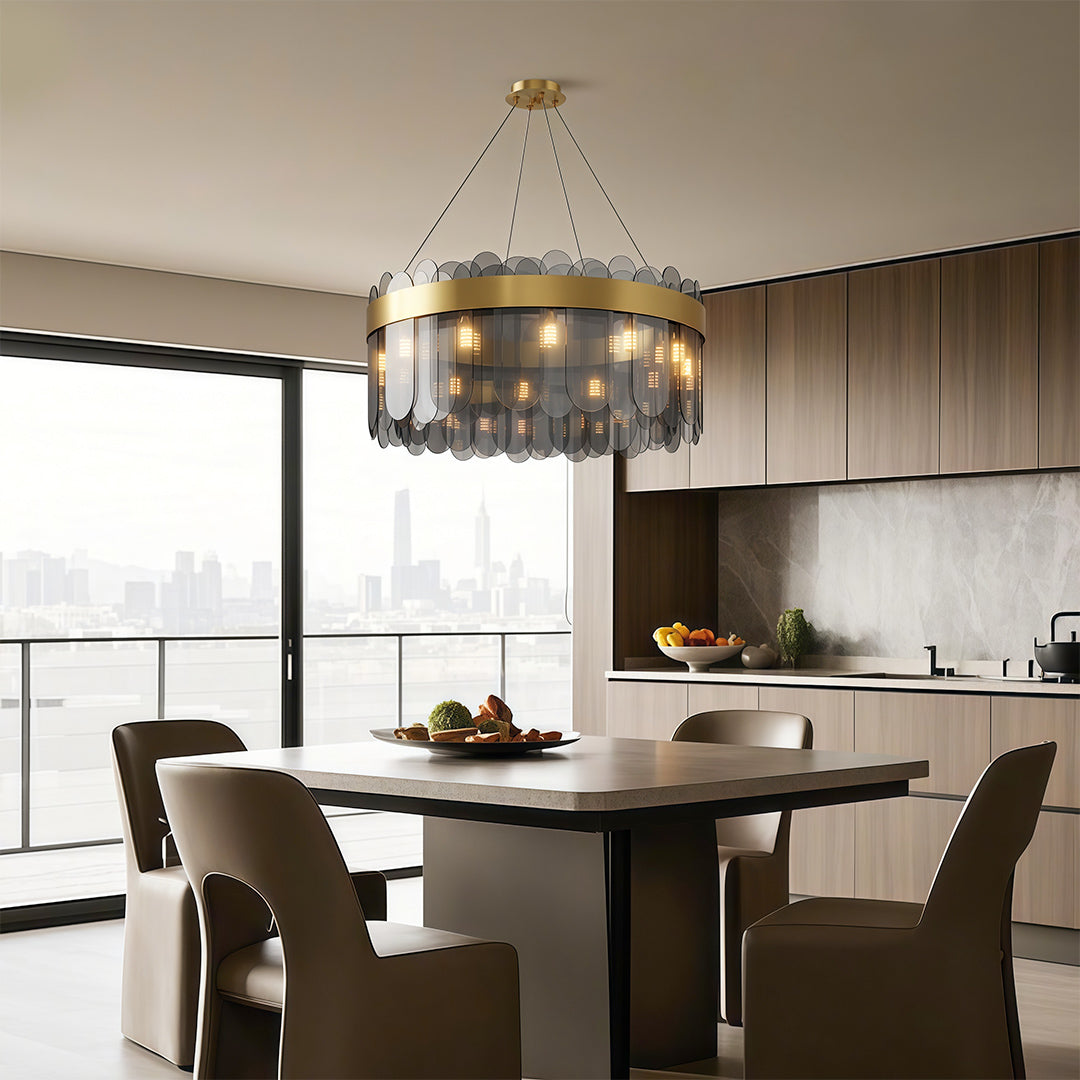 Modern copper chandelier illuminating kitchen dining space with brown leather chairs