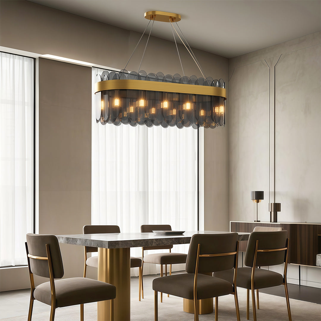 Modern luxury chandeliers creating warm ambiance in dining room with neutral palette