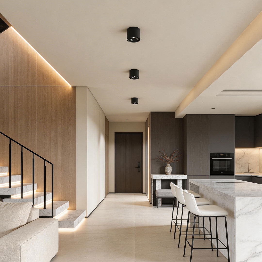 Modern corridor illuminated by ceiling spotlights highlighting the architectural design.
