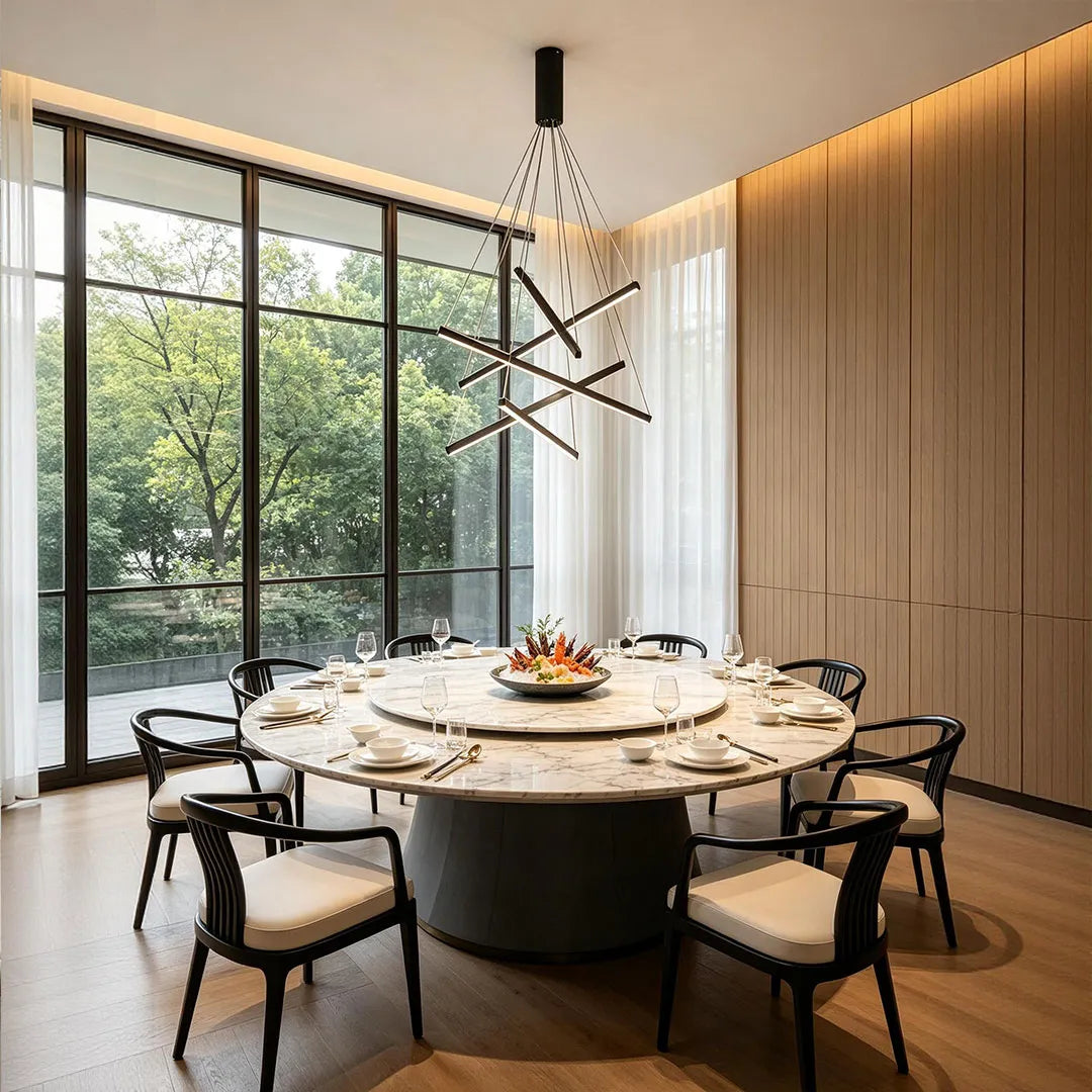 Criss linear chandelier with crossed linear arms hanging above a dining table in a contemporary interior.
