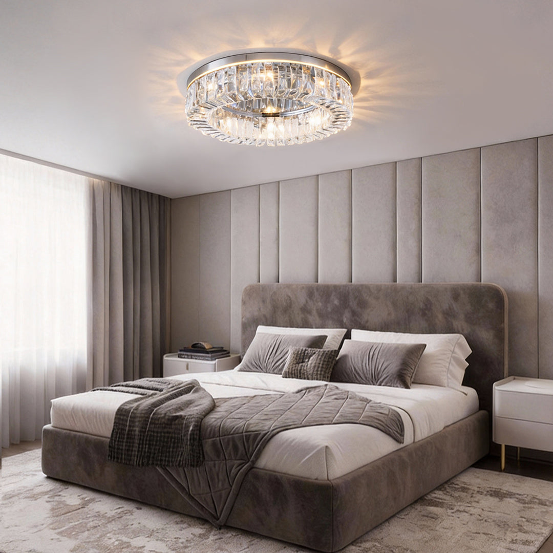 Modern crystal ceiling light installed in a luxury bedroom with soft ambient lighting.
