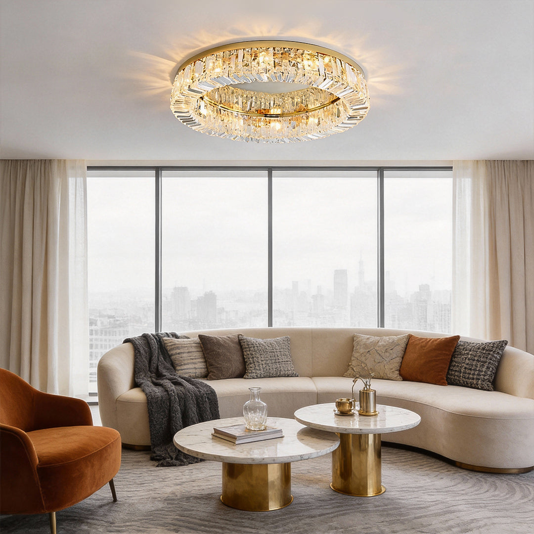 Modern crystal ceiling light illuminating a contemporary living room seating area.