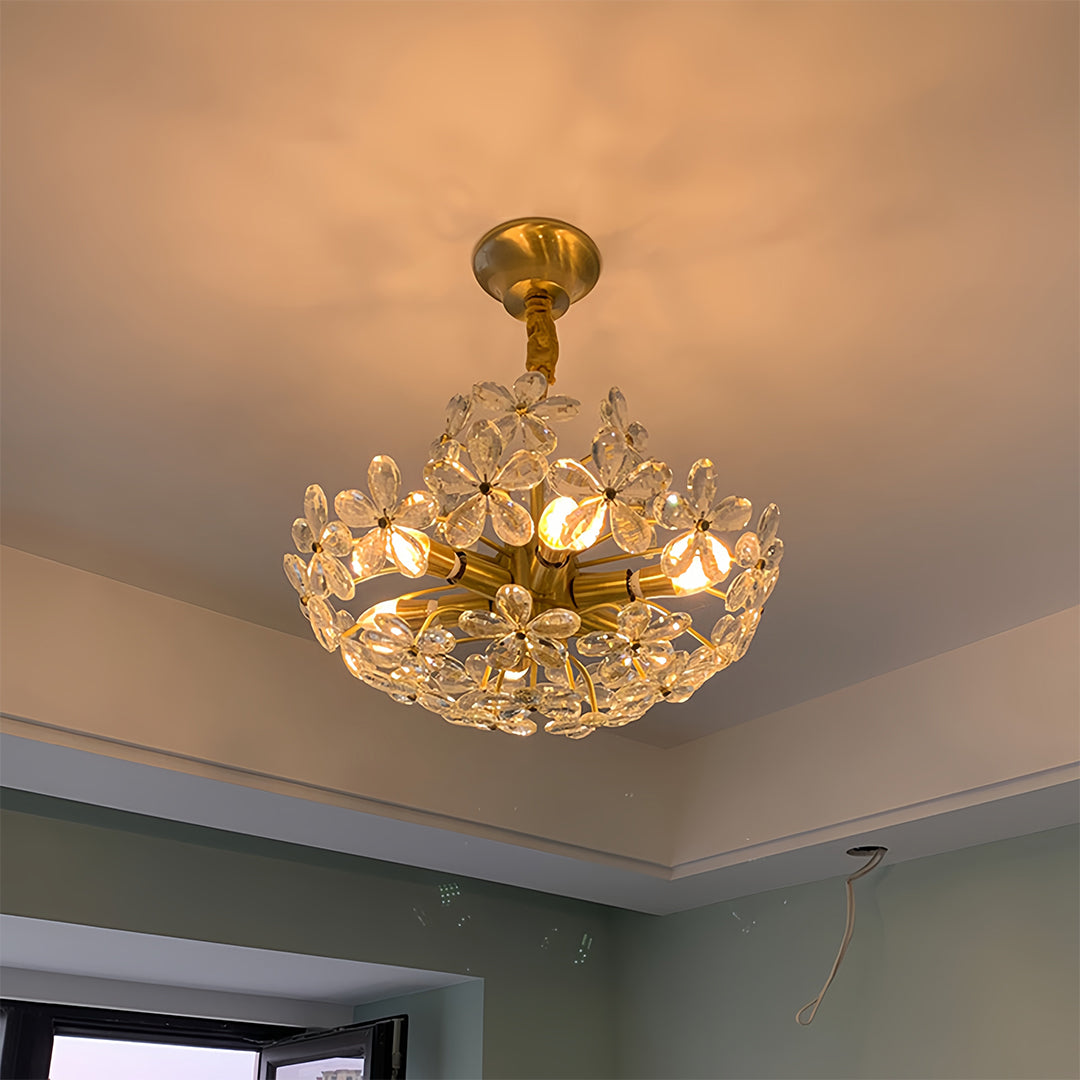 Modern crystal flower chandelier with warm golden glow in contemporary ceiling installation