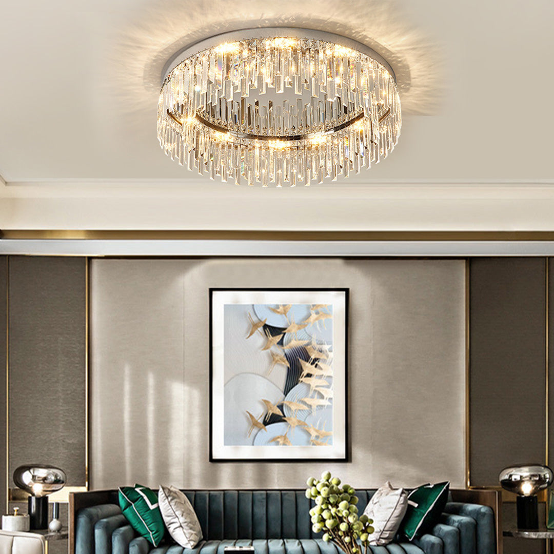 Modern crystal ceiling light installed in contemporary space with gray walls and artwork