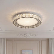 Stunning modern crystal flush mount lighting with a silver crystal ring and a textured center.