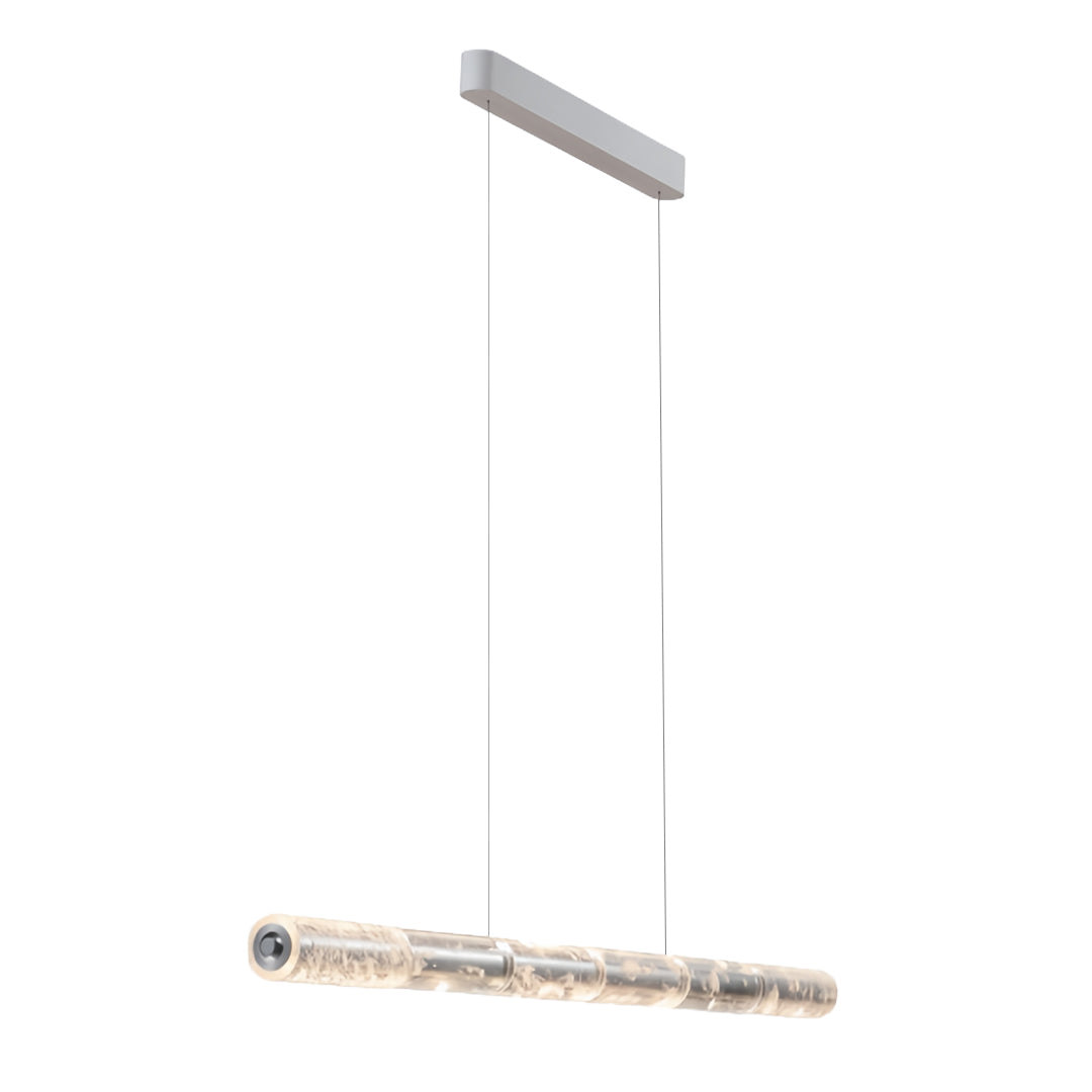 Modern crystal light pendants suspended by a thin cable, emphasizing the minimalist and sleek design.